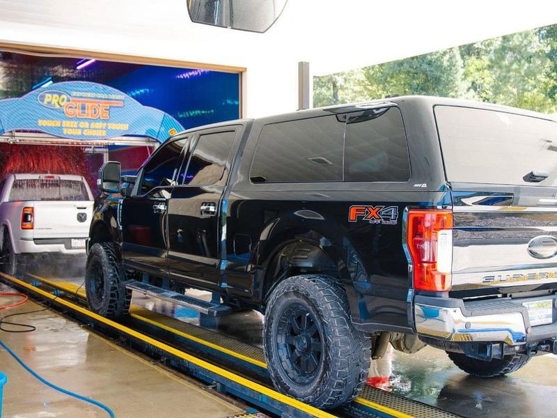 Black pickup truck entering the ProGlide Express tunnel